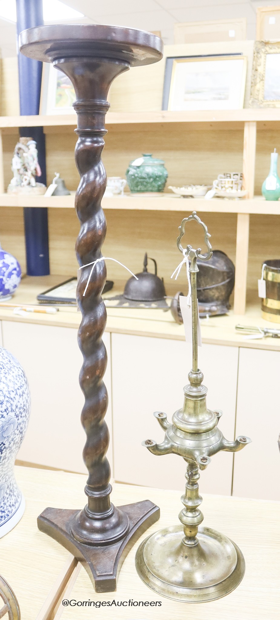 An 18th/19th century brass five light oil lamp and a lead-weighted mahogany barley-twist candlestand, tallest 77cm